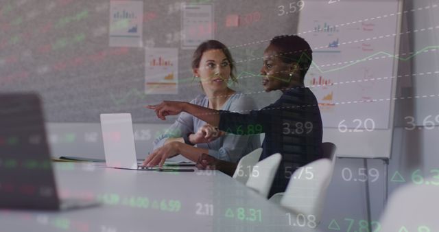 Diverse Female Colleagues Analyzing Financial Data on Laptop - Download Free Stock Images Pikwizard.com