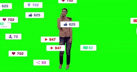 Woman engaged with social media icons on green background