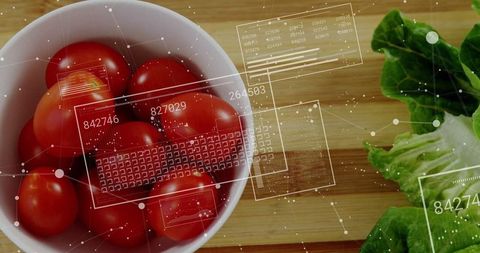 Fresh cherry tomatoes with futuristic data overlays in kitchen