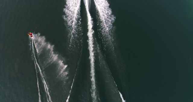 Aerial View of Jet Skis Creating Wake Patterns on Water - Download Free Stock Images Pikwizard.com