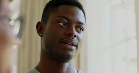 Warmly Smiling African American Man at Joyful Wedding Celebration