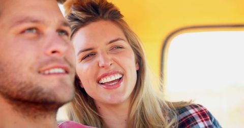 Happy Couple Enjoying Sunny Day with Big Smiles