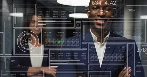 Business leaders presenting data with futuristic hud overlays in glass office corridor