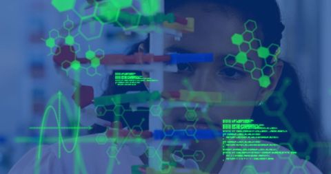 Schoolgirl engaged in hi-tech science study with digital interface