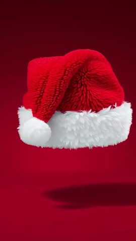 Floating Santa Hat Rotating and Bobbing on Red Background with Soft Shadow - Vertical Loop