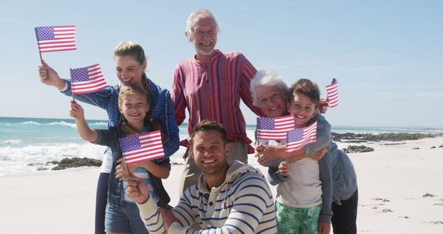 Happy Family Celebrating with American Flags at the Beach - Download Free Stock Images Pikwizard.com