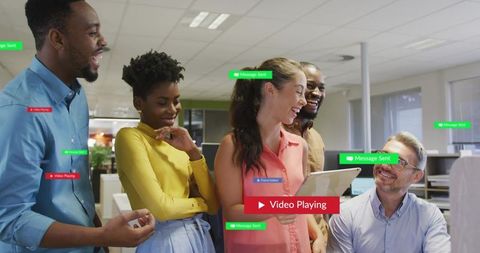 Diverse Team Collaborating Around Tablet Sharing Ideas and Messages in Bright Office