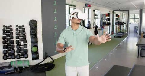 Man Using VR Headset for Physical Therapy in Rehabilitation Center