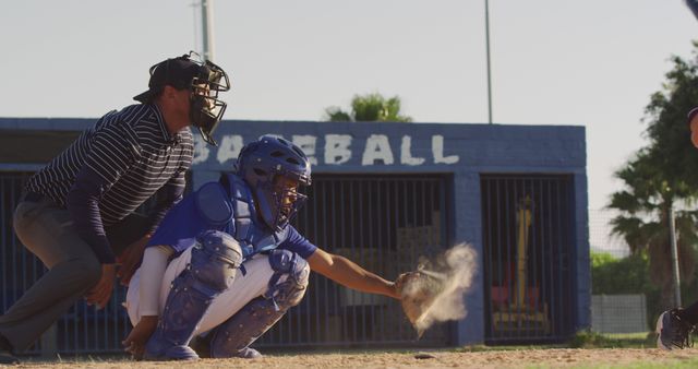 Baseball Catcher Throwing Dust Cloud While Umpire Watches - Download Free Stock Images Pikwizard.com