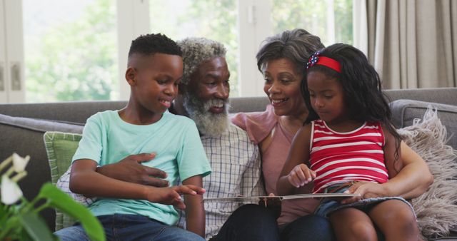 Grandparents Reading Storybook with Grandchildren in Cosy Living Room - Download Free Stock Images Pikwizard.com