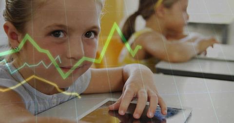 Young girl using tablet for interactive learning with color data graph overlays