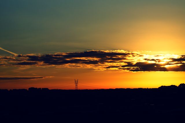 Stunning Sunset Over Power Lines and Horizon Silhouette - Download Free Stock Photos Pikwizard.com