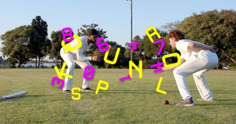 Crouching cricketers preparing catch on sunny grass field with neon letter overlay
