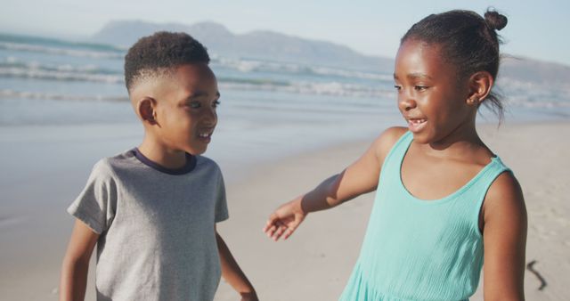 Two Smiling Children Playing on Beach on Sunny Day - Download Free Stock Images Pikwizard.com