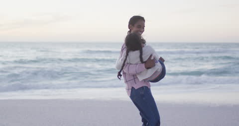 Joyful Mother and Daughter Bonding at the Beach