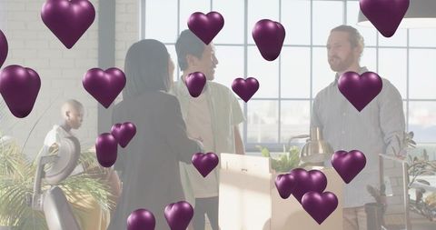 Team moving into modern office with purple heart graphics and plant-filled workspace