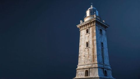 Majestic Lighthouse Against Dark Blue Sky