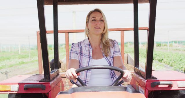 Confident Female Farmer Driving Tractor on Sunny Day - Download Free Stock Images Pikwizard.com