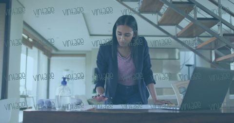 Professional Woman Analyzing Data in Office Environment