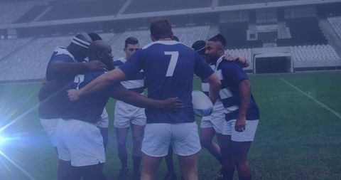 Diverse Rugby Team Unified in Pre-Game Huddle at Stadium