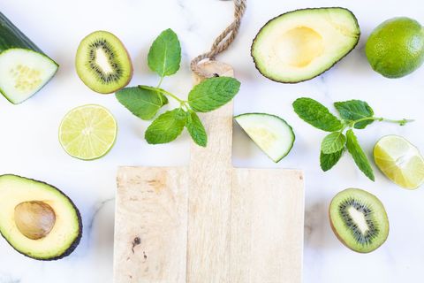 Fresh Ingredients with Cutting Board on White Marble Background
