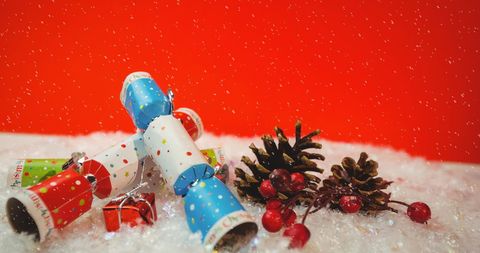 Festive Christmas Crackers with Snowfall on Red