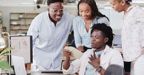 Team Celebrating Success Synergizing in Modern Office