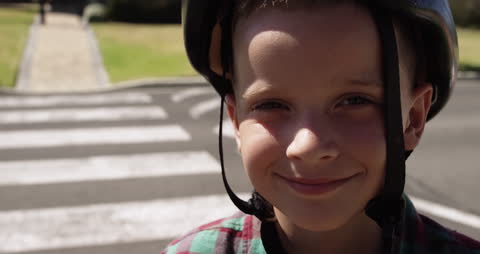 Smiling Boy With Helmet at Pedestrian Crosswalk Focus on Safety