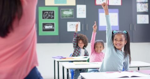 elementary students enthusiastically participating in school classroom - Download Free Stock Images Pikwizard.com