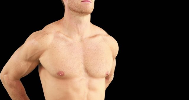 A shirtless Caucasian man stands confidently, showcasing his muscular physique, with copy space - Download Free Stock Photos Pikwizard.com