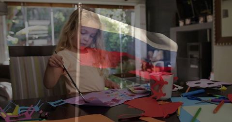 Child in creative art activity with overlayed flag symbol