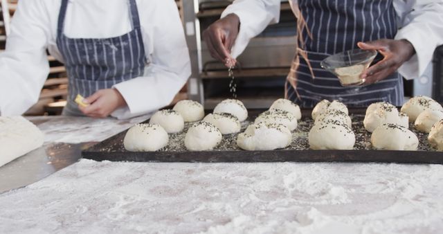 Professional Bakers Preparing and Seasoning Bread Dough - Download Free Stock Images Pikwizard.com