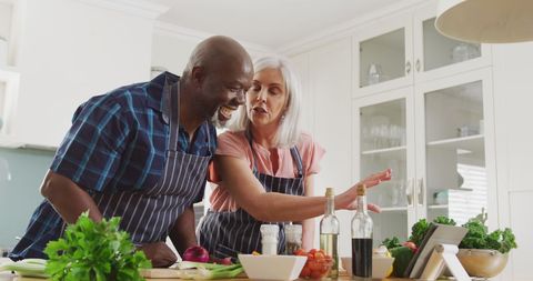 Happy Senior Couple Cooking Together in Bright Kitchen - Download Free Stock Images Pikwizard.com