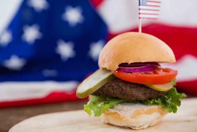 Close-up of Delicious Burger with American Flag - Download Free Stock Photos Pikwizard.com