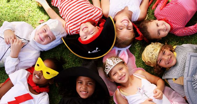 Group of Diverse Children in Colorful Costumes Having Fun Outdoors - Download Free Stock Images Pikwizard.com