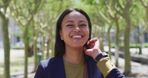 Cheerful Woman Walking in Natural Park Setting