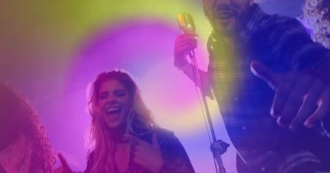 Energetic band performance with colorful lights and vintage microphone