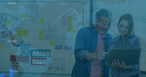 Business Professionals Analyzing Financial Data on Laptop in Office