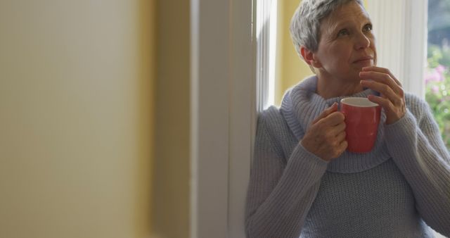 Thoughtful Senior Woman Relaxing with Coffee Mug - Download Free Stock Images Pikwizard.com