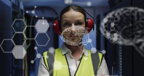 Engineer analyzing data through virtual interface in server room