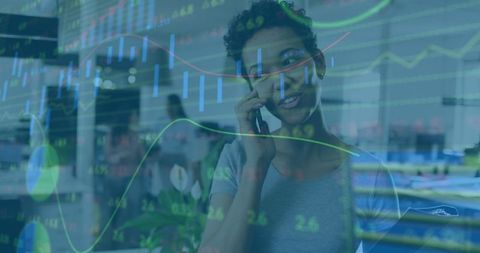 Businesswoman Analyzing Data Talking on Smartphone