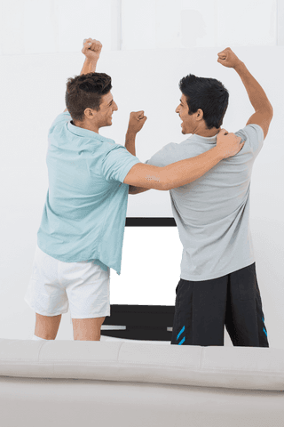 two men in home celebrating transparent television screen - Download Free Stock Videos Pikwizard.com
