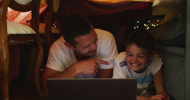 Father and Son Bonding in Blanket Fort with Laptop - Download Free Stock Images Pikwizard.com