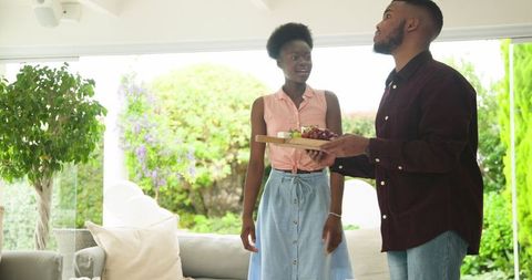 Couple enjoying quality time in bright airy living room