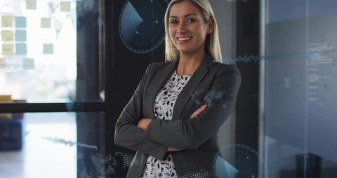 Confident Business Leader Using Glass Dashboard and Data Visuals in Modern Workspace