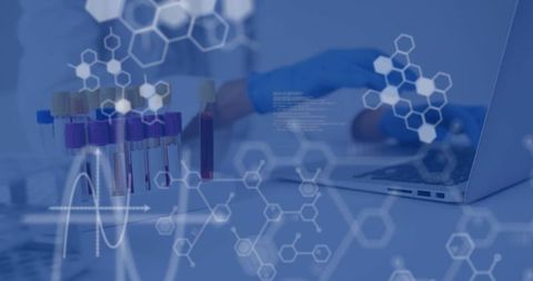 Technician analyzing blood samples and molecular data using laptop in lab