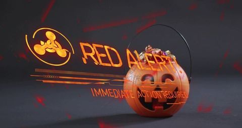 Jack-o'-lantern candy bucket with holographic red alert overlay and biohazard icon