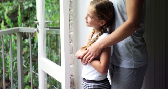 Mother and Daughter Looking Out Window with Sunlight - Download Free Stock Images Pikwizard.com