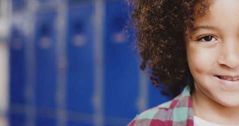 Smiling Biracial Child in Front of Blue School Lockers - Download Free Stock Images Pikwizard.com