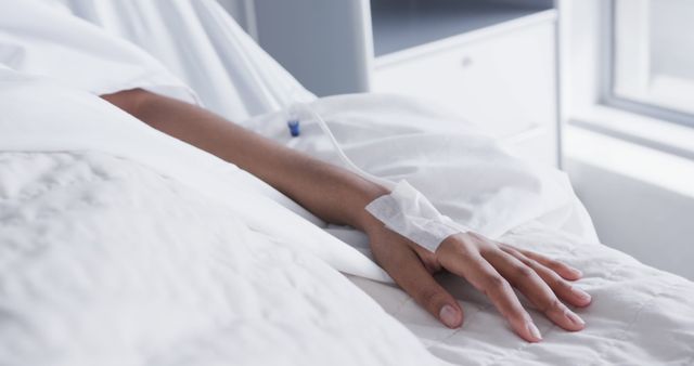 Close-up of Patient's Hand with IV Drip on Hospital Bed - Download Free Stock Images Pikwizard.com